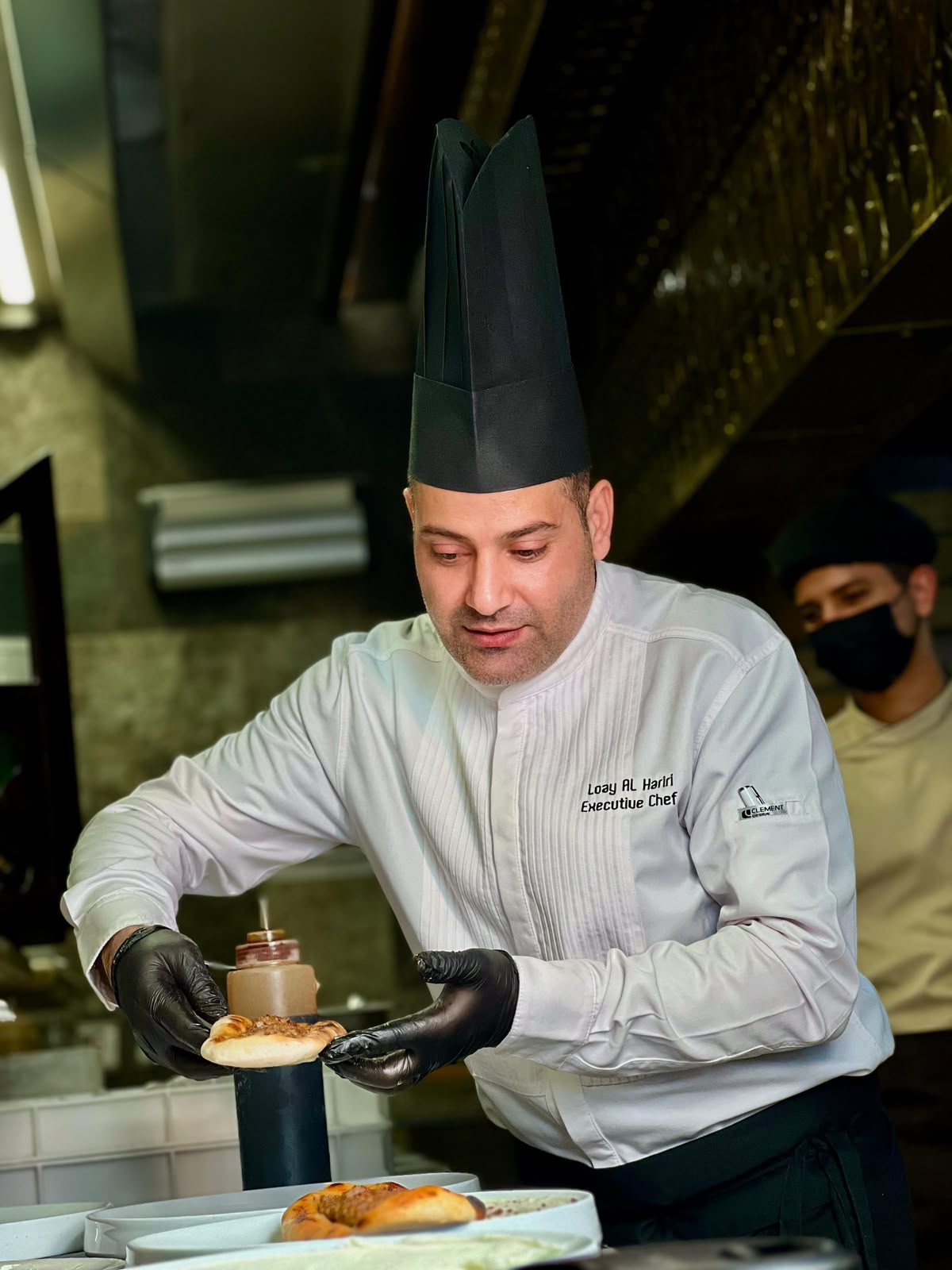 Chef Loai Alhariri working in the kitchen